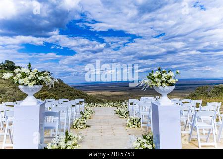 Kenyan Weddings Bush Wild Beautiful stunning wedding outdoors set up decoration on location in Angama Mara Maasai Mara National Game Reserve Park Grea Stock Photo