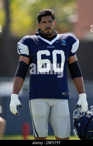 Dallas Cowboys offensive tackle Isaac Alarcon wears the flag of