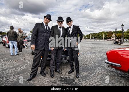 Paris, France. 30th July, 2023. Fake Men In Black attends at the 16th summer crossing of Paris in vintage vehicle on July 30, 2023. Stock Photo