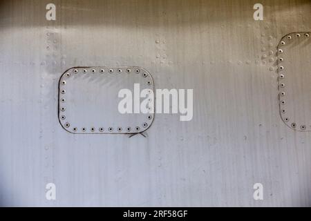 aluminum sheets joined together by welding and riveting, close up of ...