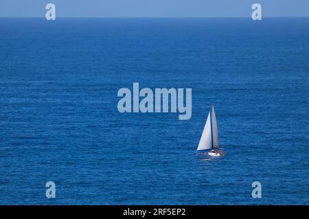 Cabin Sailing Yacht On Vast Open Ocean Stock Photo