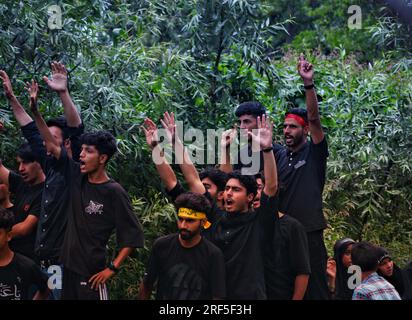 Kashmiri Shiite Muslims chant religious slogans as they participate in ...