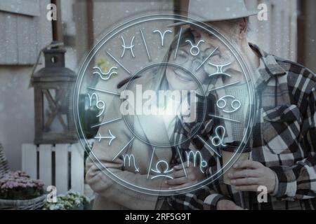 Horoscope compatibility. Loving couple and zodiac wheel Stock Photo