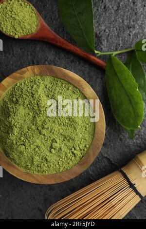 Flat lay composition with green matcha powder on grey table Stock Photo