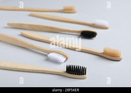 Different bamboo toothbrushes on white background Stock Photo - Alamy