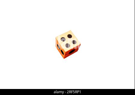 An orange foam dice on a white background Stock Photo