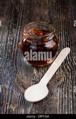 natural viscous honey with nuts, which is produced by honey bees, honey is packaged and used in food because it contains a large amount of carbohydrat Stock Photo