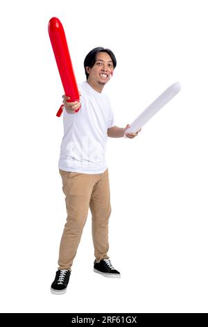 Indonesian man supporting Indonesian team when competing isolated over white background Stock Photo