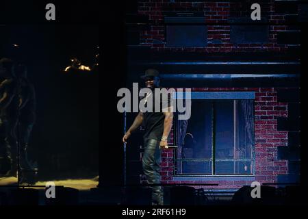 Toronto, Canada. 31st July, 2023. 50 Cent perfoms on stage wearing a black t-shirt, black leather pants and a black baseball cap Credit: Bobby Singh/Alamy Live News Stock Photo