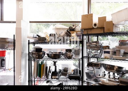 Exploring in the diverse collection of commercial kitchen essentials, featuring an array of assorted utensils and appliances. Stock Photo