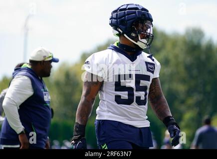 Seattle Seahawks linebacker Jon Rhattigan (59) arrives on the field along  with offensive tackle Jake Curhan (74) and defensive end Dre'Mont Jones  (55) before the NFL football team's mock game, Friday, Aug.