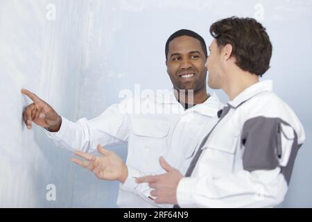 craftsman and young apprentice working together Stock Photo