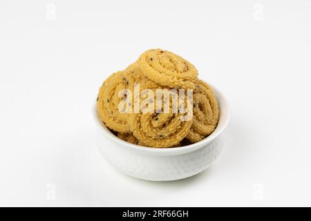 MURUKKU, Kerala  special snack made using rice flour, isolated image arranged in white background. Stock Photo