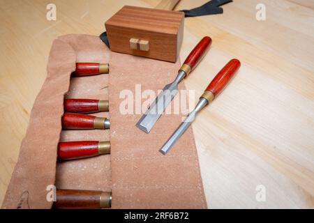 Set of chisels and a mallet on a clean workbench Stock Photo