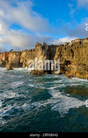 Panoramic view of the Boca de Inferno, where tourists enjoying the waves crushing on the rocks in Cascais Portugal Stock Photo