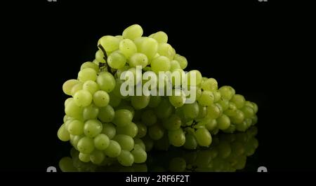White grapes with drops of water, isolated on black background Stock Photo