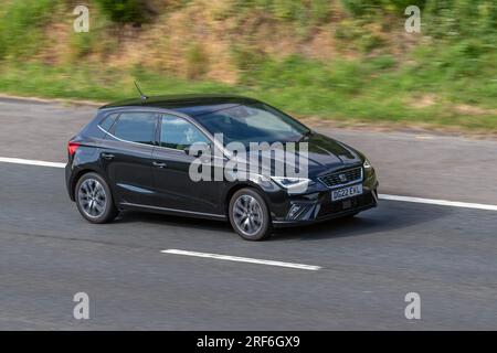 2022 Seat Ibiza Xcellence Tsi 110 Start/Stop Black Car Hatchback Petrol 999 cc travelling at speed on the M6 motorway in Greater Manchester, UK Stock Photo