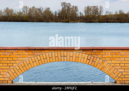 A brick arch in a wall close to the Dnieper river in Kiev, Ukraine Stock Photo