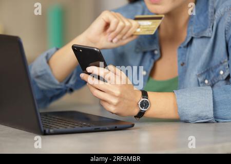 woman receiving authentification code on smartphone to confirm online purchase Stock Photo