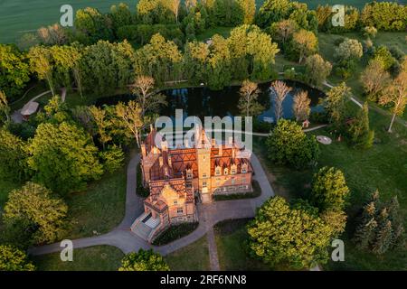 Jaunmoku brick medieval castle and its territory near Tukums, Latvia, aerial view Stock Photo