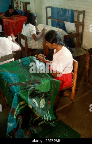 Women painting fabrics, Sri Lanka, batik Stock Photo