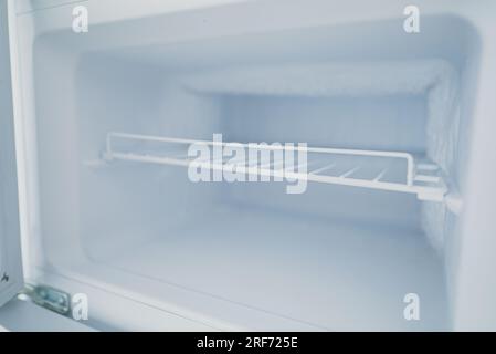Empty open freezer in the refrigerator. Stock Photo