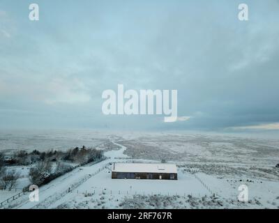 Modern eco bungalow in winter. Stock Photo