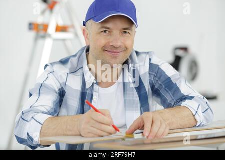 thoughtful man holding using his pencil Stock Photo