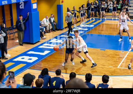 Central Noble Cougars' Connor Essegian guards a Hammond Bishop Noll player in an IHSAA high school basketball game at North Judson, Indiana, USA. Stock Photo