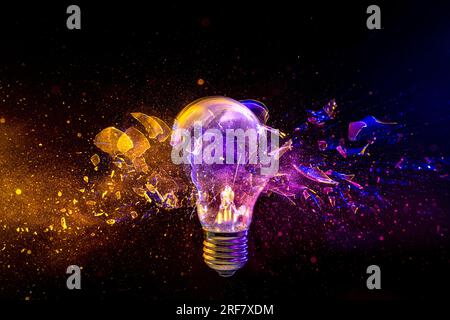 light bulb shattering on black background. concept of creativity and innovation Stock Photo