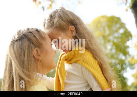 Mother and Daughter face to face. Sharing a moment between mother and daughter. Horizontal photo Stock Photo