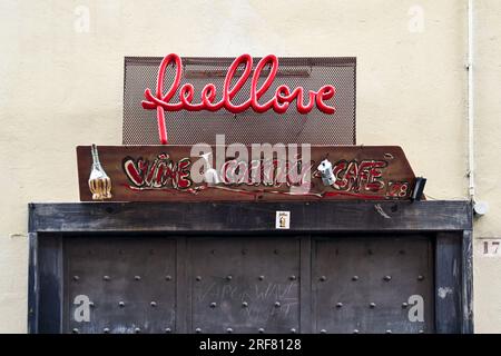 Exterior and sign of a cocktail bar decorated with found objects in the old town, Genoa, Liguria, Italy Stock Photo