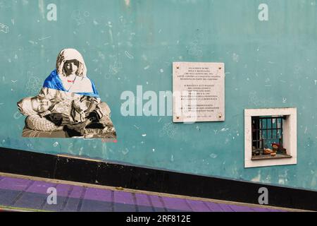 Mural against the Ukraine war next to a memorial plaque dedicated to the Resistance against fascism at Luzzati Gardens, Genoa, Liguria, Italy Stock Photo