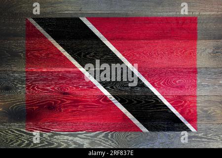 Trinidad and tobago flag on rustic old wood surface background Stock Photo