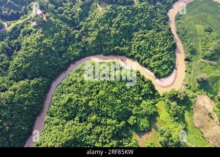 Khagrachhari, Bangladesh - July 23, 2023: The crooked Chengi River flows through the hills of Khagrachari district in Bangladesh. Stock Photo