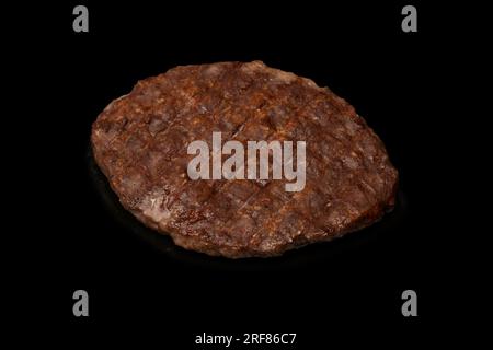 Cutlet with minced beef isolated on a black background. Stock Photo
