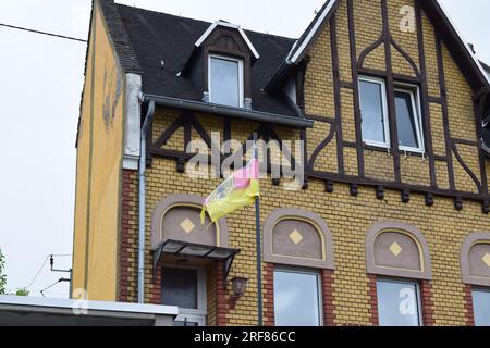 ragged German flag at an old house Stock Photo