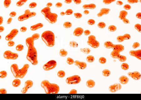 Red jam splashes isolated on a white background. Top view. Stock Photo