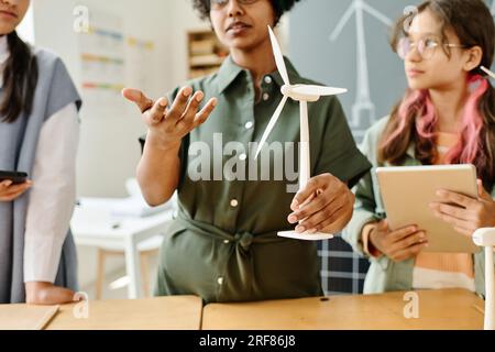 African American teacher talking about windmill to students at lesson Stock Photo