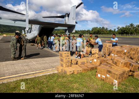 Basco, Philippines. 31st July, 2023. U.S. Marines with Marine Medium Tiltrotor Squadron 163 and Philippine Marines unload emergency food and water, from an MV-22B Osprey aircraft during relief efforts in the wake of Typhoon Egay, July 31, 2023 in Basco, Batanes Province, Philippines. The category 4 hurricane sweep across part of the Philippines with 140 mph winds killing at least 26 people and causing widespread damage. Credit: Cpl. Sean Potter/US Army/Alamy Live News Stock Photo