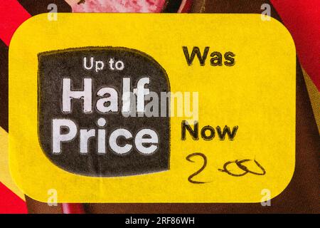 up to half price yellow sticker label on food product - box of Magnum Double Raspberry icecreams ice creams - price reduction, price mark down Stock Photo