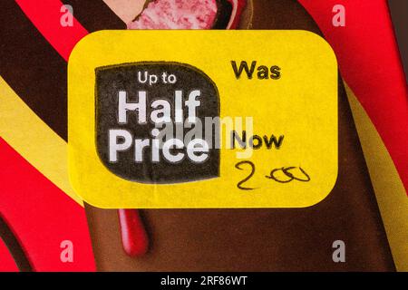 up to half price yellow sticker label on food product - box of Magnum Double Raspberry icecreams ice creams - price reduction, price mark down Stock Photo