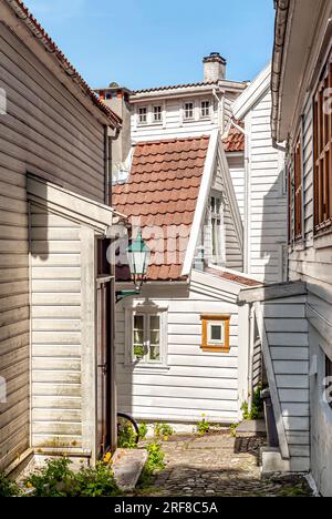 Narrow house entrance of historic Weatherboard houses at the historic Nordnes Quarter of Bergen, Norway Stock Photo