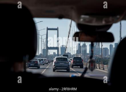 Traveling west in a taxi across the Bosphorus Bridge which connects the Asian side of Istanbul with the western side. Stock Photo