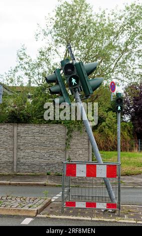 symbolic picture, traffic light out of balance; approached pedestrian traffic light is crooked Stock Photo