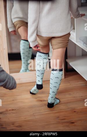 Close up of the hands of an elderly woman knitting sock. High quality photo Stock Photo