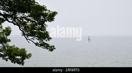 Single sailboat on calm waters of Lake Erie Stock Photo