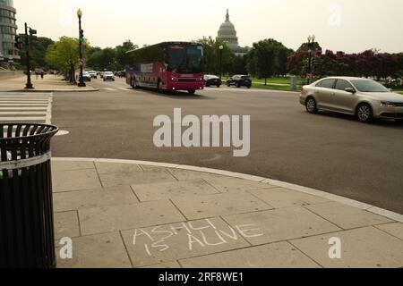 Washington, DC, USA. 1 Aug 2023. Support for January 6th rioter Ashli Babbitt, who was killed during the Capitol siege, is written in chalk outside the federal courthouse. Credit: Philip Yabut/Alamy Live News Stock Photo