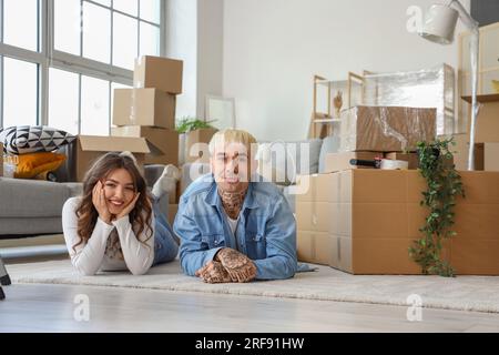 Young couple lying in room on moving day Stock Photo