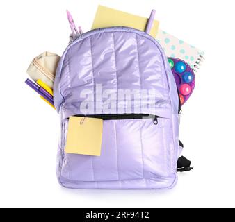 Lilac school backpack with notebooks and different stationery on white background Stock Photo